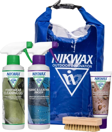 The Nikwax Hiking Kit, 300ml bottles of Nikwax Footwear Cleaning Gel and Nikwax Nubuck & Suede Proof, 60ml tube of Waterproofing Wax for Leather, a show brush and a blue Nikwax drybag.