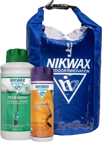 The Nikwax Outdoor Protection kit, a 1l bottle of Nikwax Tech Wash, a 300ml bottle of Nikwax TX.Direct and a blue drybag with the Nikwax logo. 